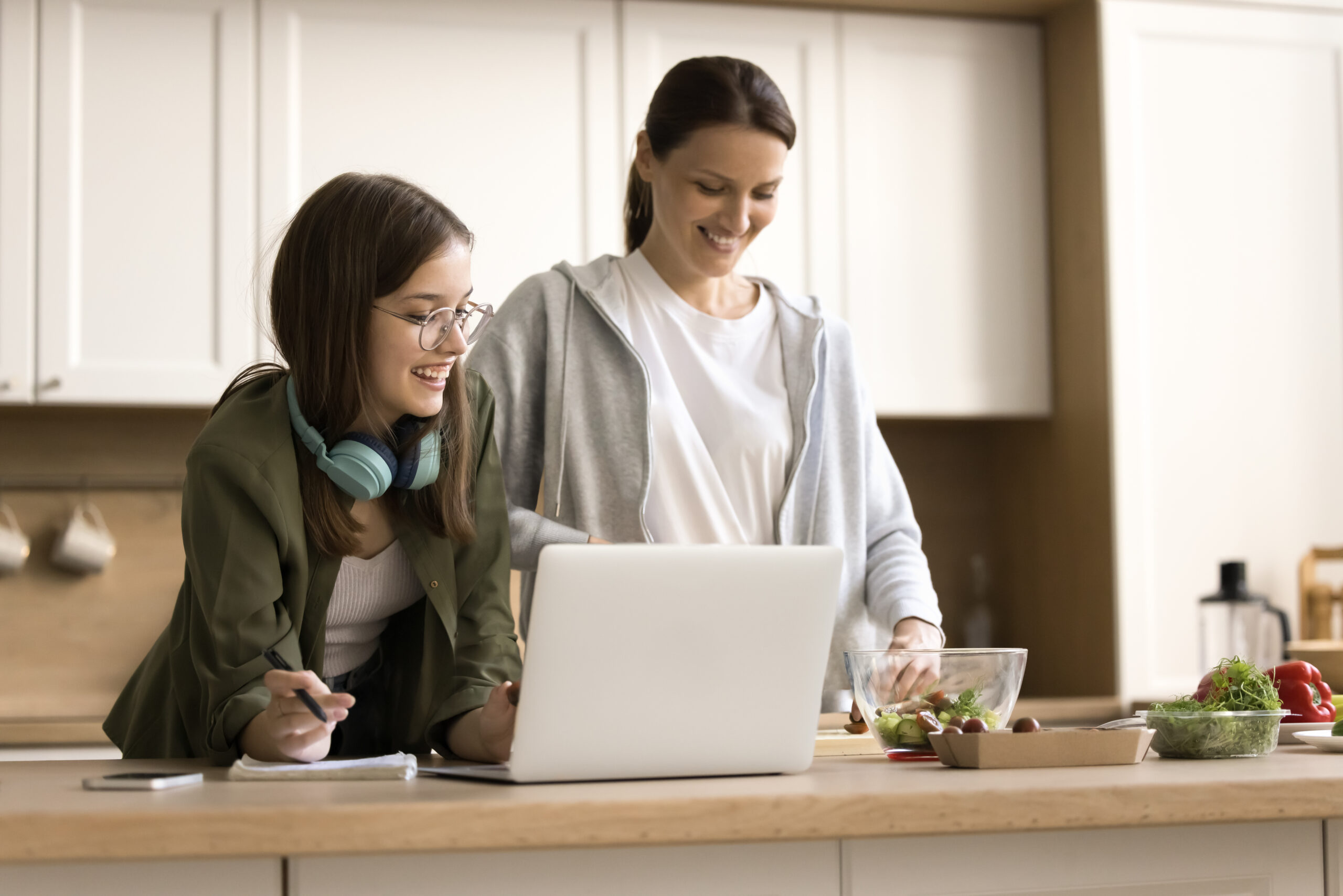 Parent and high school student working on a laptop. 
